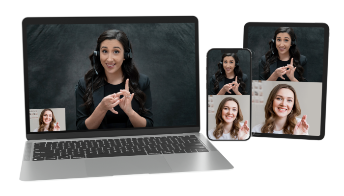 Over a white background is a laptop, tablet, and cell phone. The laptop shows an image of a woman with black hair, in a black blazer, shirt and black background, signing and smiling. In the left corner of the laptop screen is a woman with brown hair, smiling and signing as well. On the tablet and cell phone is the same image of the two women.